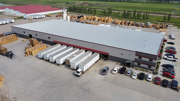 drone photo of building | The Pallet Company - West Fargo, ND