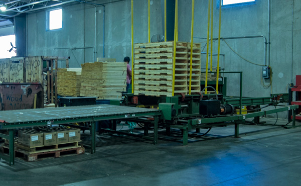 pallet machine in warehouse | The Pallet Company - West Fargo, ND